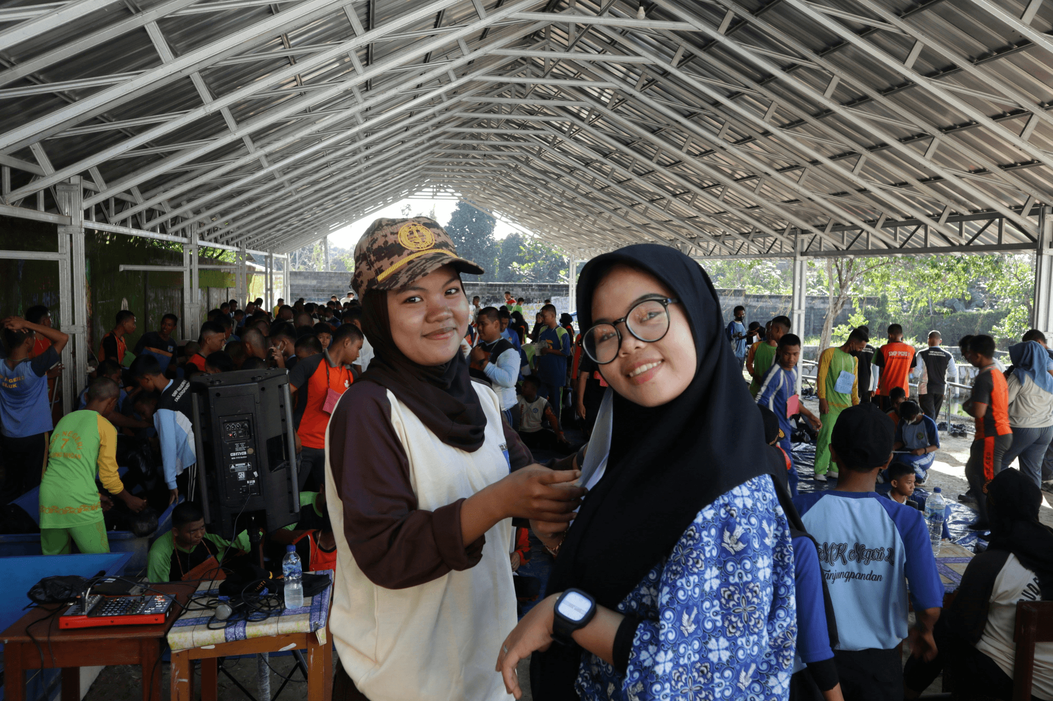 Happy employees enjoying recreational activities inside a modern modular camp building