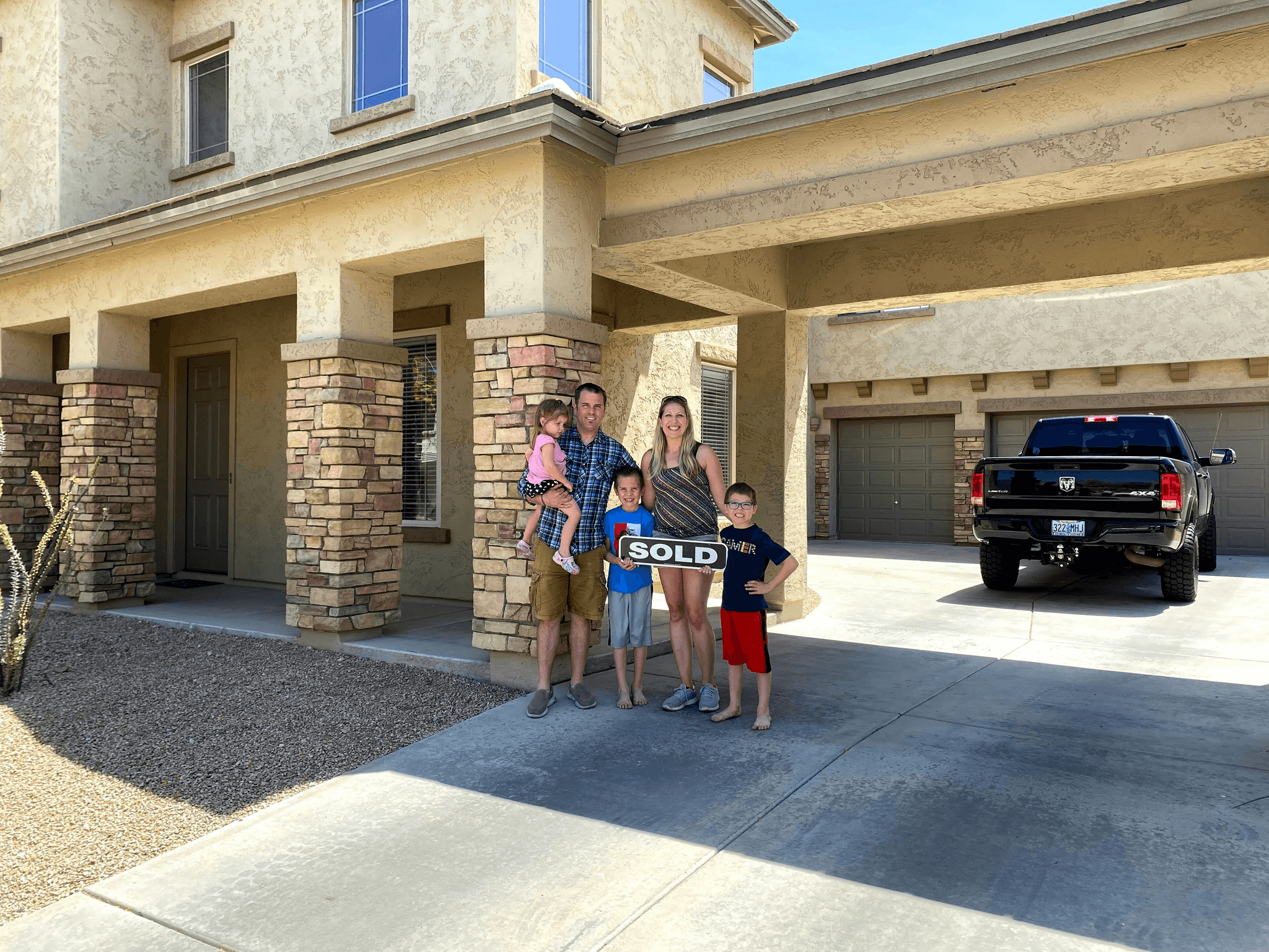 Happy family embracing affordable living with PreFab Inc.'s modular home under 100k