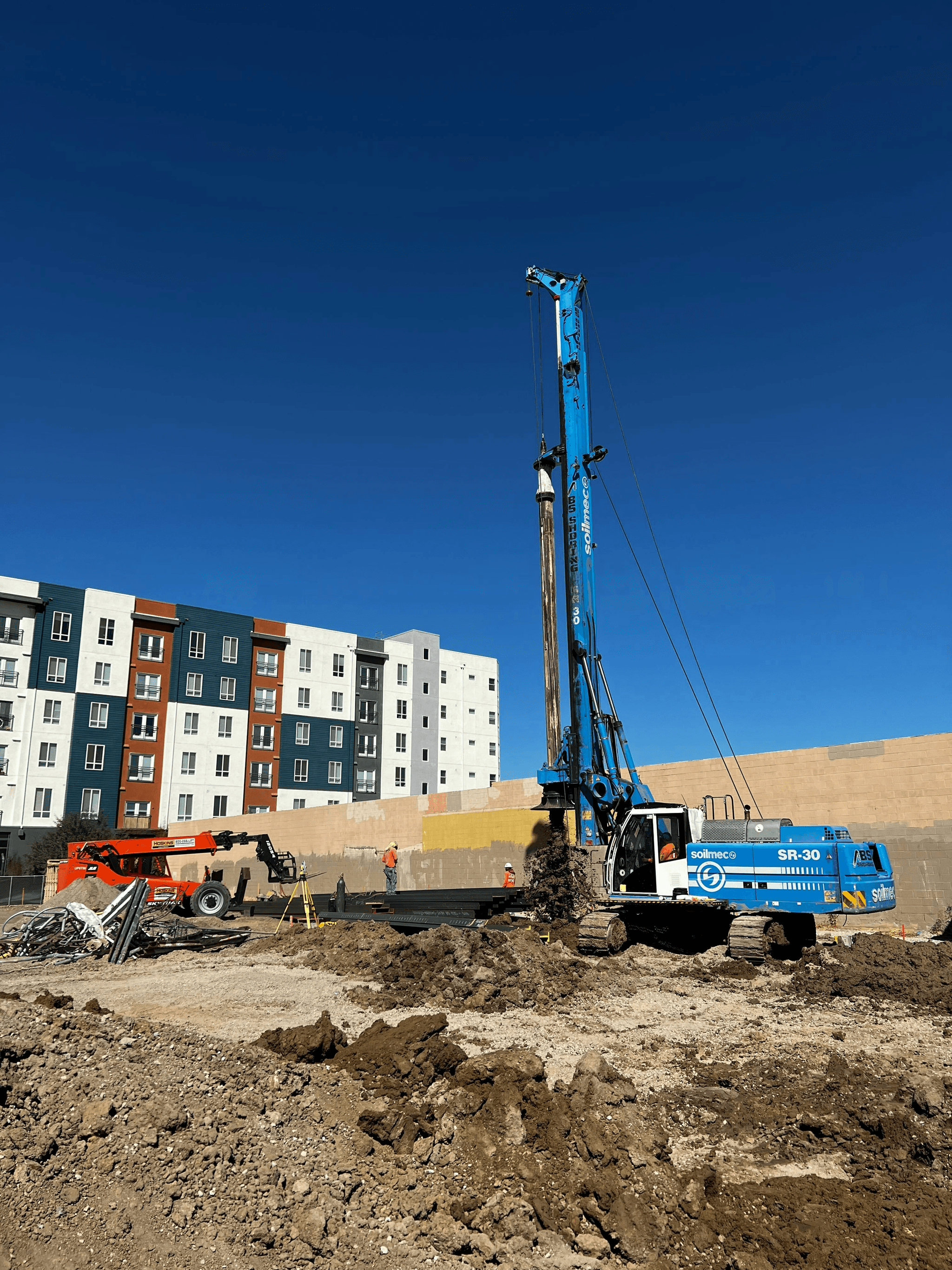 Efficient dual-power drill rig used in down hole hammer drilling