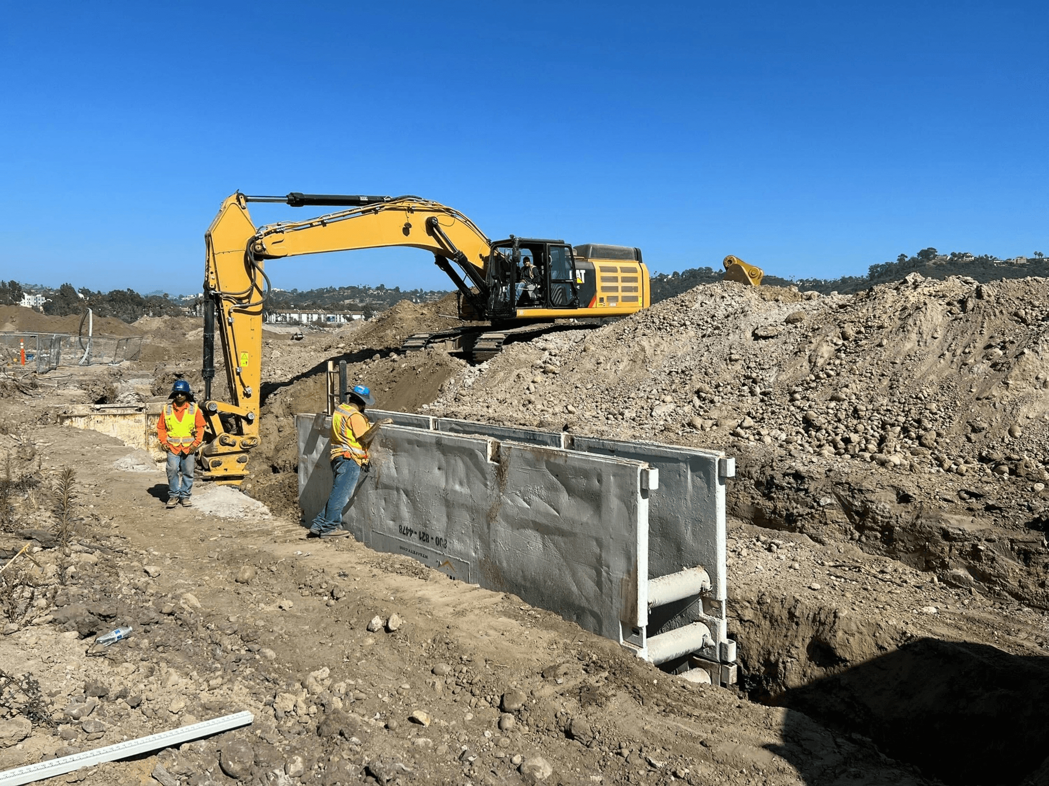 heavy equipment inspections conducted by professionals at a construction site.