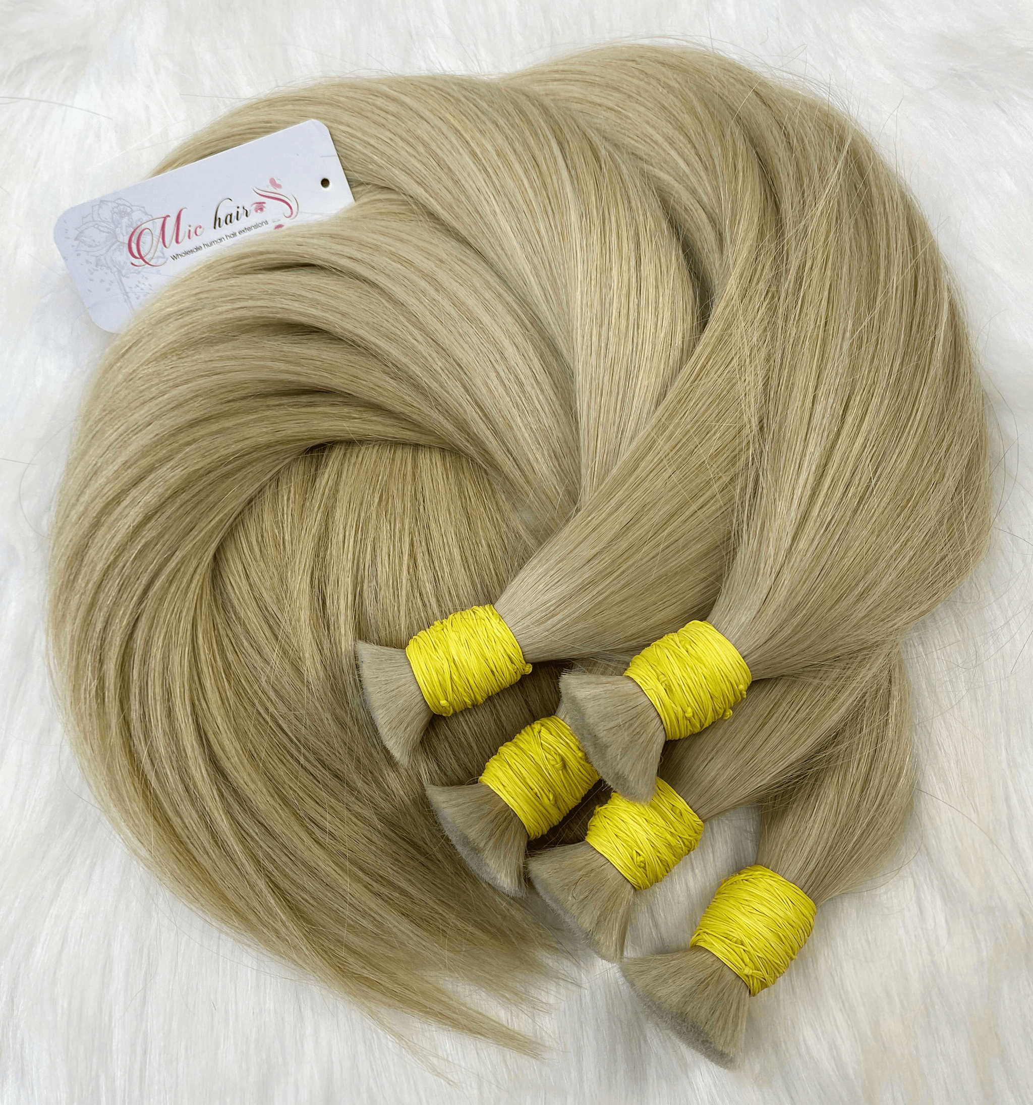 yaki straight bundles showcased beautifully on hangers