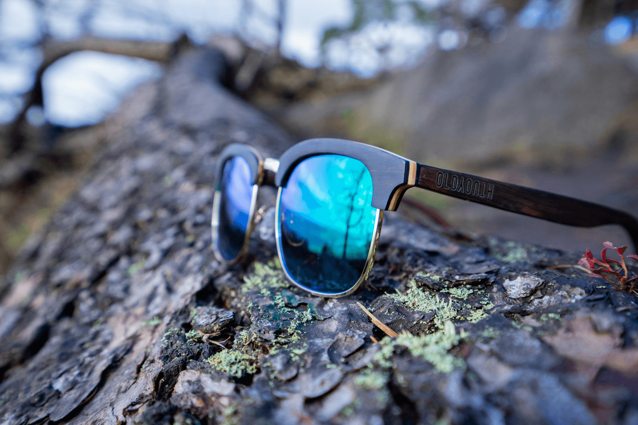 Eco-friendly wooden framed sustainable sunglasses with green-tinted lenses