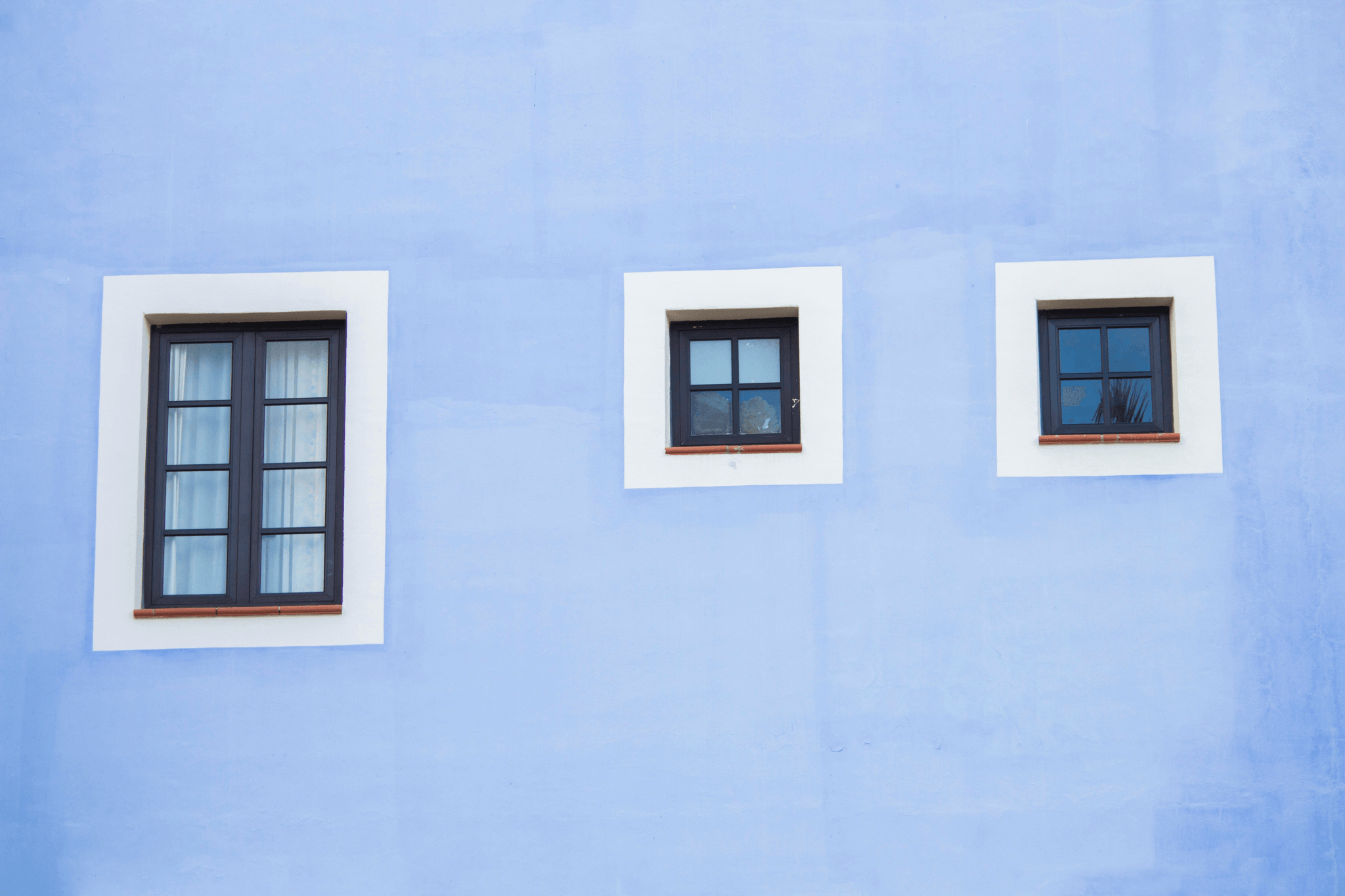 Happy customers receiving high-quality windows from reputable window manufacturers