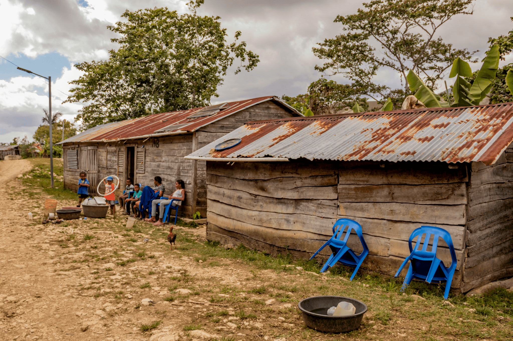 Diverse community enjoying outdoor activities in small prefab homes