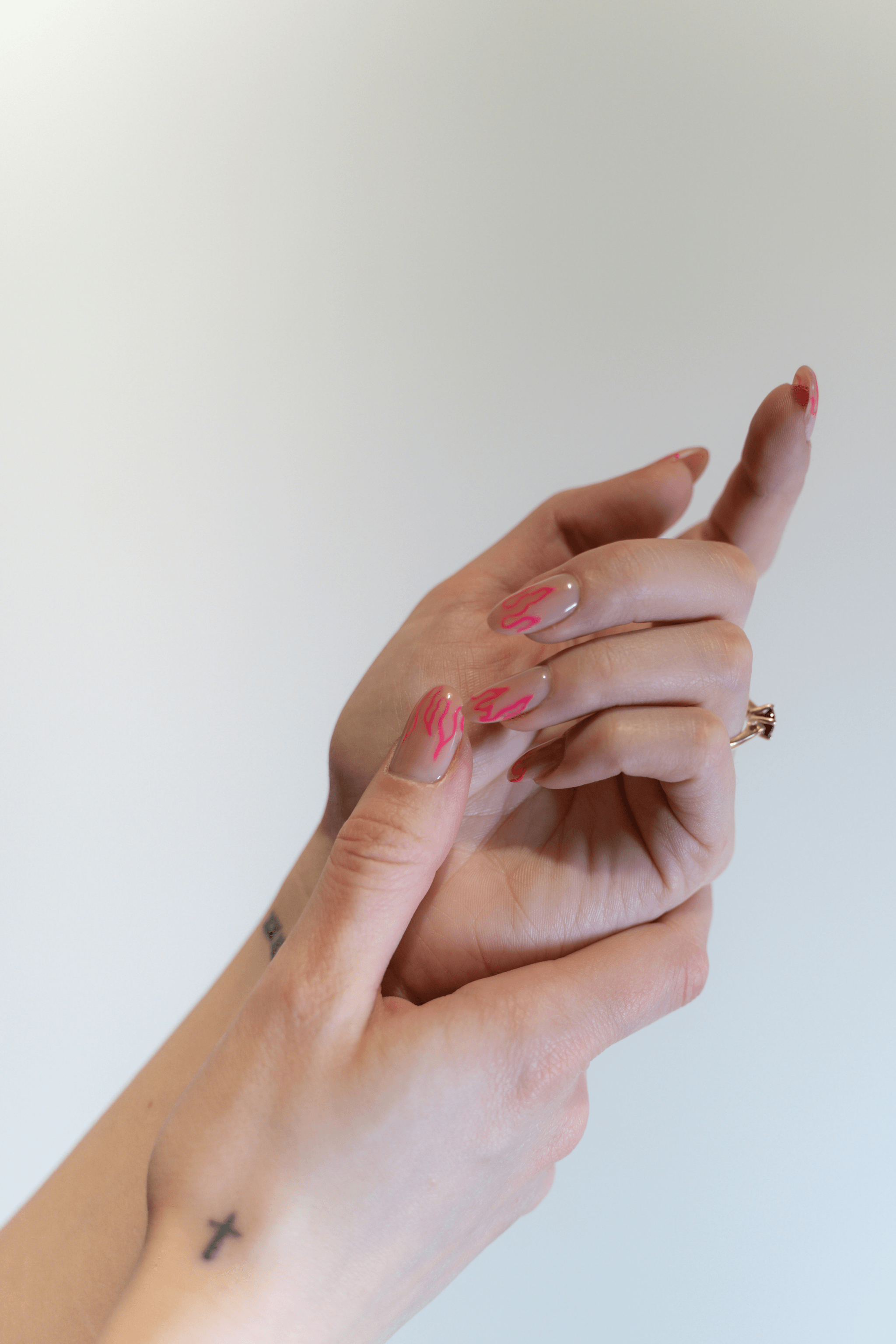 Client's hands with a freshly manicured look at OMG Hair and Beauty.