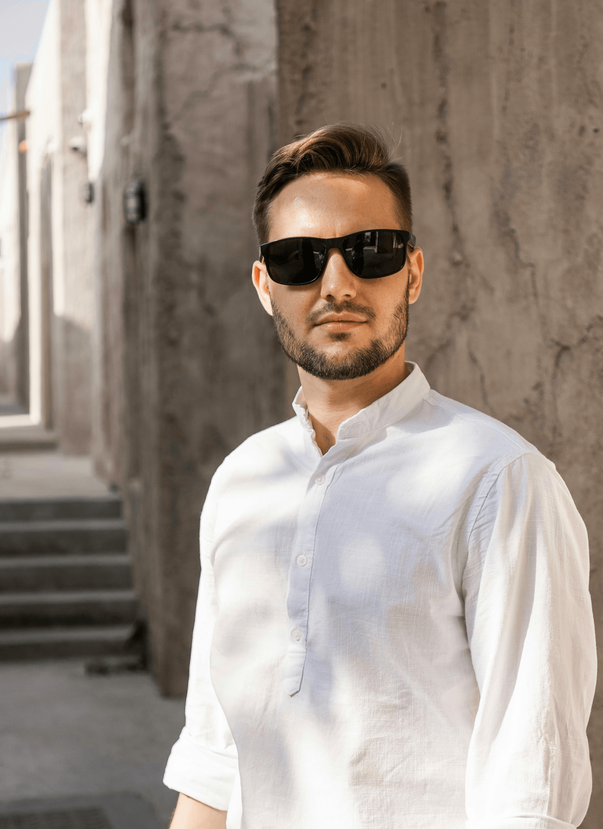 Stylish brands of sunglasses worn by man outdoors